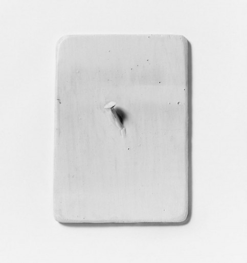 “New York”, 1966. White color on nail on wooden plate (17,5 x 12,5 cm).