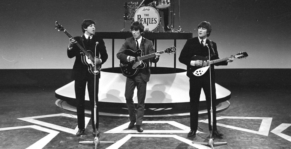 Paul and John, in their matching dark suits, boldly flank George Harrison onstage during a recording session for a Dutch television show in 1964. (Dutch Nationaal Archief, via In Focus)