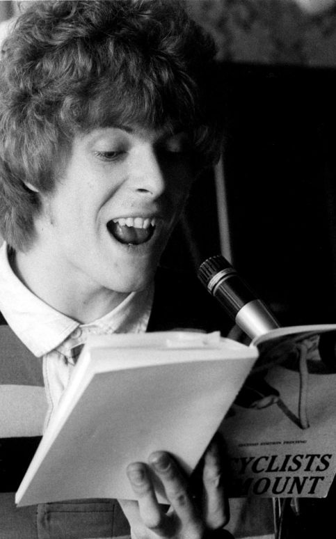 David Bowie at the Beckenham Arts Lab in 1969 reading the 1964 book Bicyclists Dismount by Mason Williams CREDIT: REX FEATURES