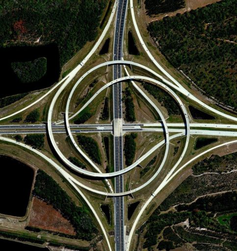 A turbine interchange connects two highways in Jacksonville, Florida. This structure consists of left-turning ramps sweeping around a centre interchange, thereby creating a spiral pattern of right-hand traffic.