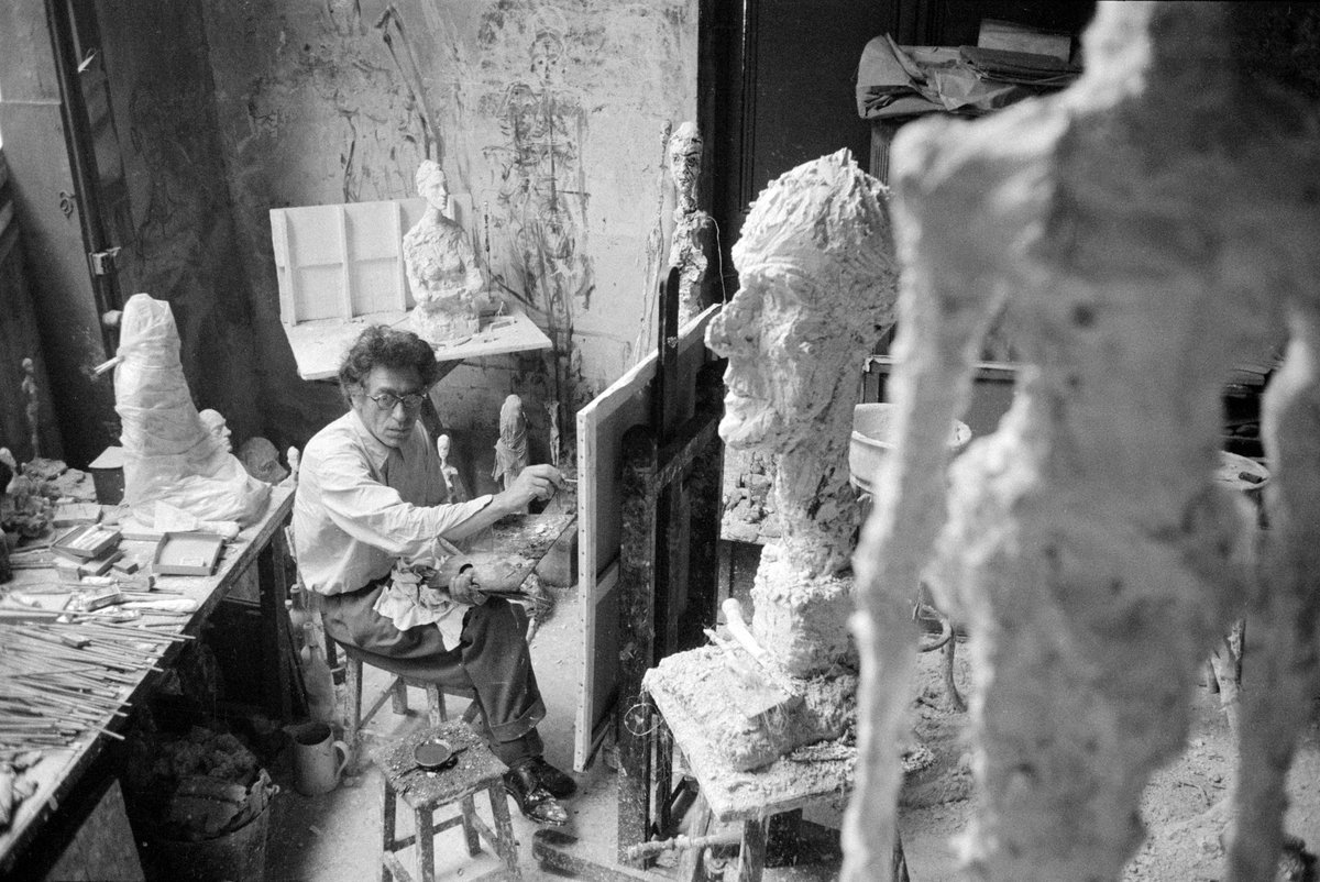 Giacometti painting in his Paris studio, in the foreground La Grande Tête, 1958